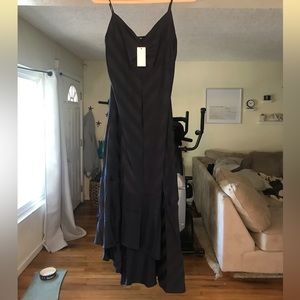 Vici sold navy wedding guest dress. Medium. Loose fitting. High low hem.